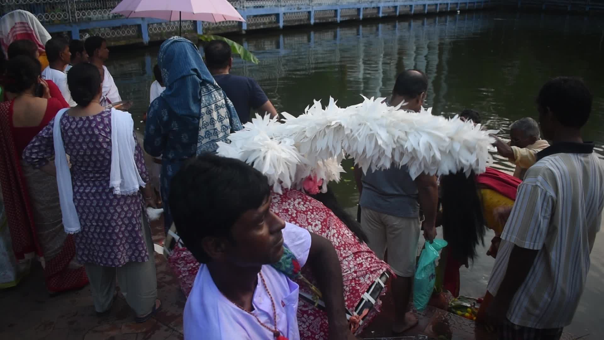 Devotees performing Nabapatrika ritual on the occasion of the Durga Puja festival in Kolkata, India