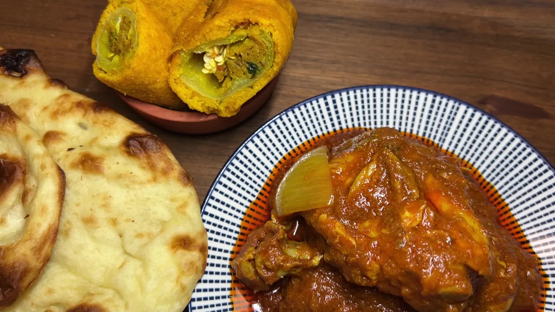 Chicken Karahi served with naan and hot chili pakoras