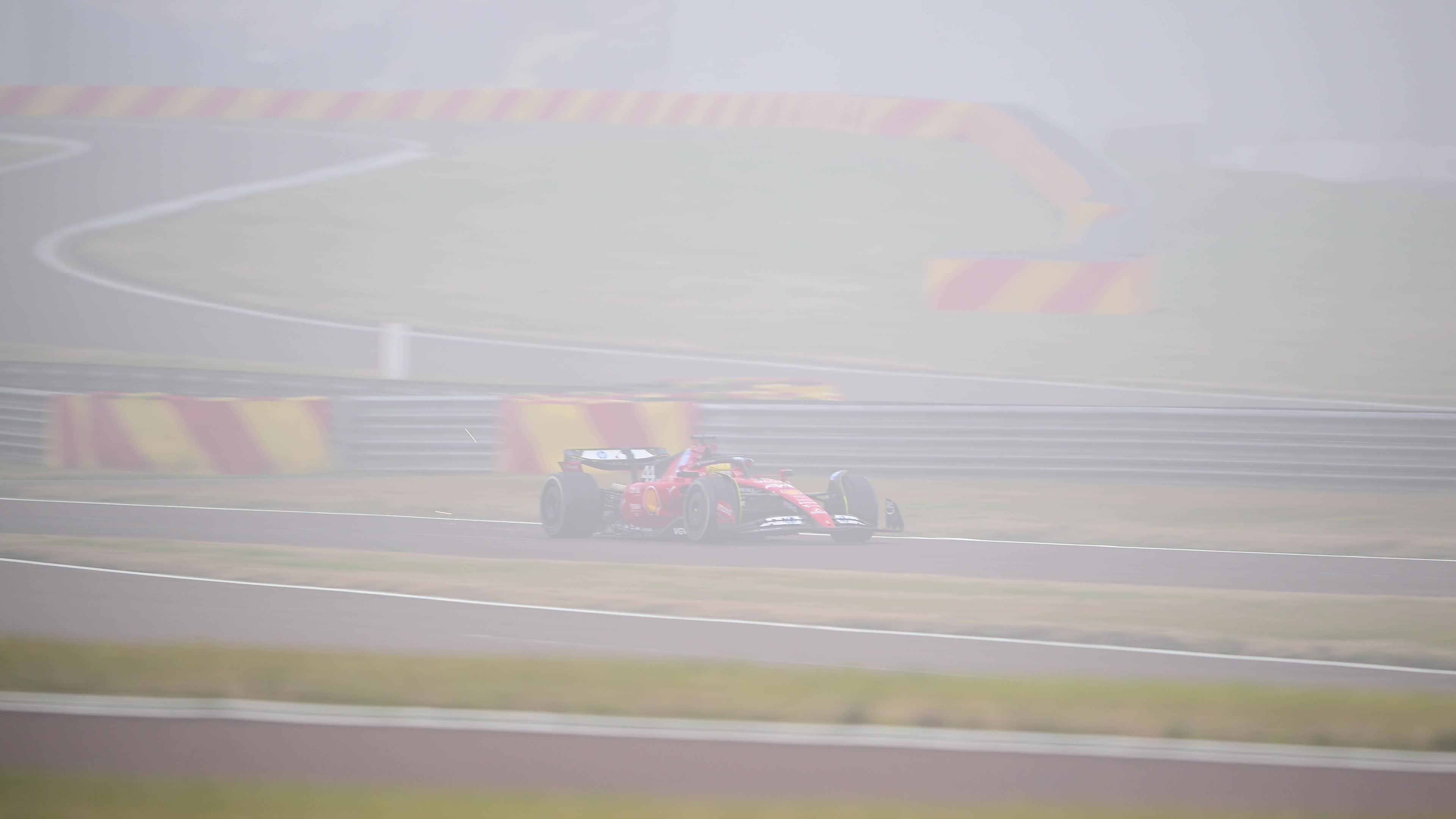 Lewis Hamilton drives on the track during the first day of tests as a Scuderia Ferrari F1 driver at the Fiorano Circuit in Maranello 